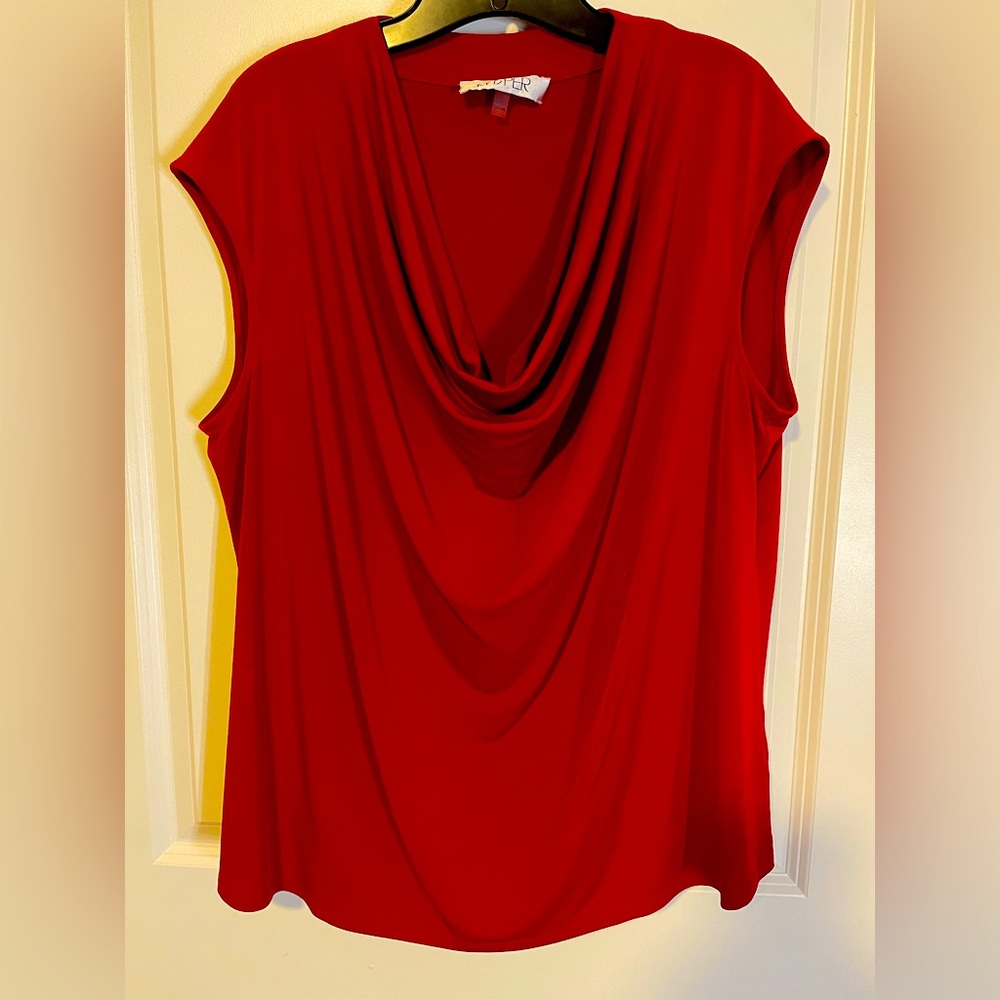 Red sleeveless top with scoop neck.
